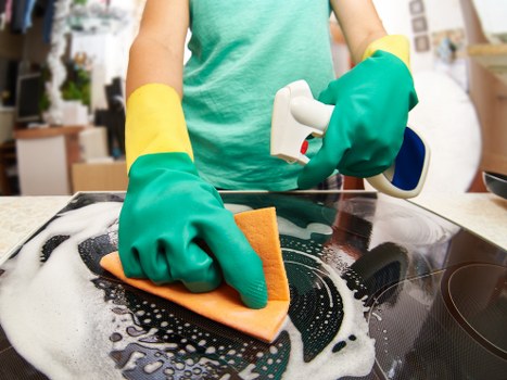 Technician using equipment for deep upholstery cleaning in Barkingside