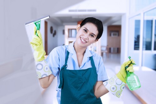 Cleaning technician checking supplies and work area precautions